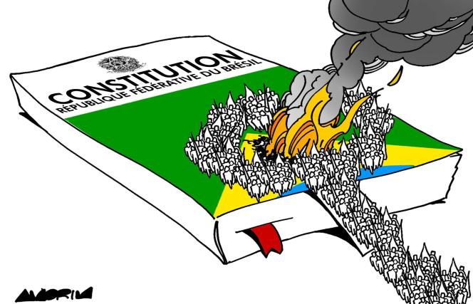 Constituição brasileira em chamas na charge de Amorim, membro da associação Cartooning for Peace, que foi estampada na primeira página do jornal francês Le Monde de 11/1/2023.